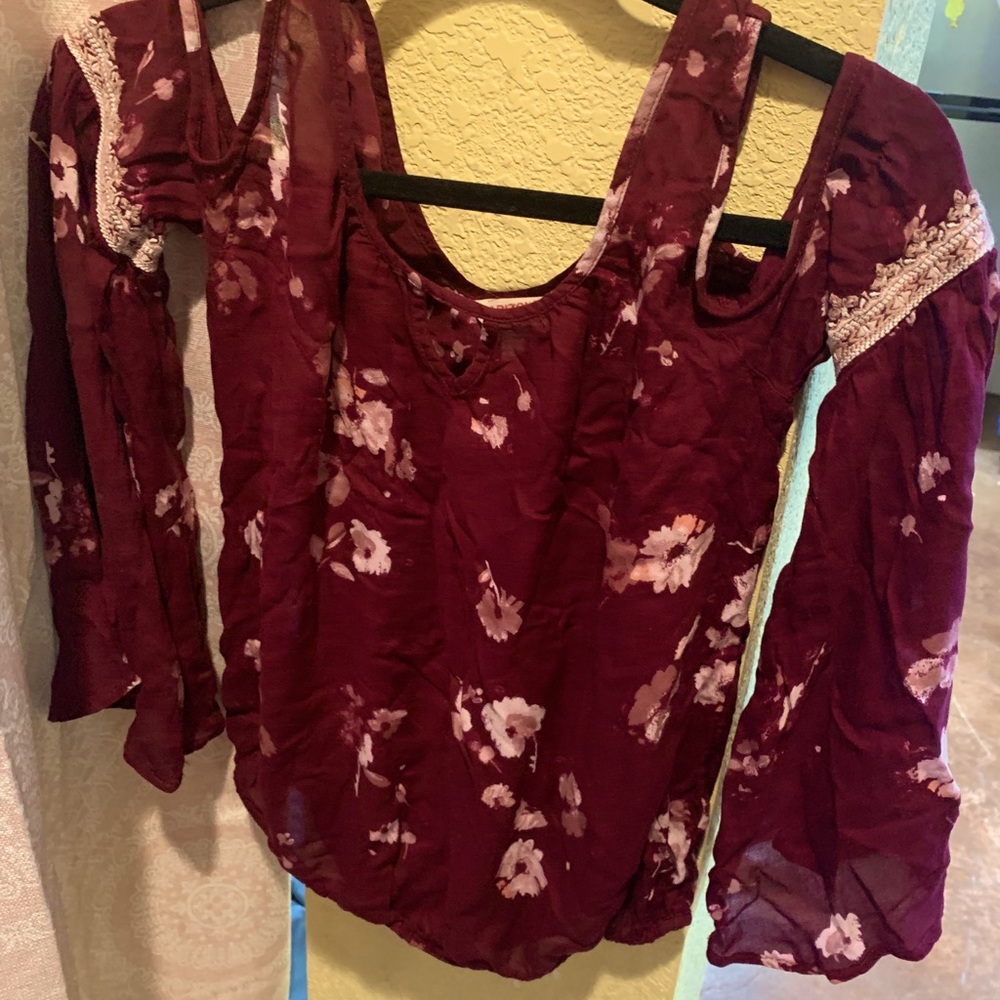 Long sleeve, off the shoulder dress shirt.